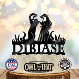 Black otter bride and groom wedding cake topper with a veil, floral details, Mr and Mrs lettering, and the personalized surname DIBIASE.