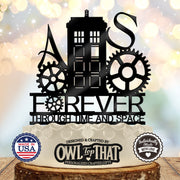 Black police call box wedding cake topper with initials A and S, decorative gears, and Forever Through Time and Space lettering.