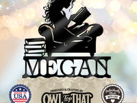 Black personalized MEGAN cake topper featuring a long-haired girl reading an open book in an armchair beside a stack of books.