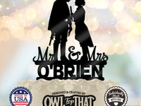Black Han and Leia wedding cake topper featuring the couple facing each other above Mr & Mrs lettering and the personalized surname O’Brien.