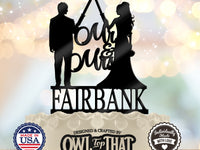 Black Jedi couple wedding cake topper featuring a bride and groom raising crossed lightsabers, Mr & Mrs script, and the personalized surname Fairbank.