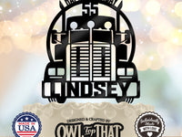 Black semi truck birthday cake topper with a front-facing big rig, arched Happy Birthday lettering, age 55, and the personalized name Lindsey across the bumper.