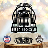 Black semi truck birthday cake topper with a front-facing big rig, arched Happy Birthday lettering, age 55, and the personalized name Lindsey across the bumper.