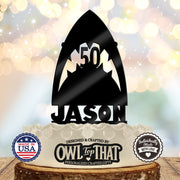 Black shark birthday cake topper with an open mouth, pointed teeth framing the personalized age 50, and the name Jason along the base.